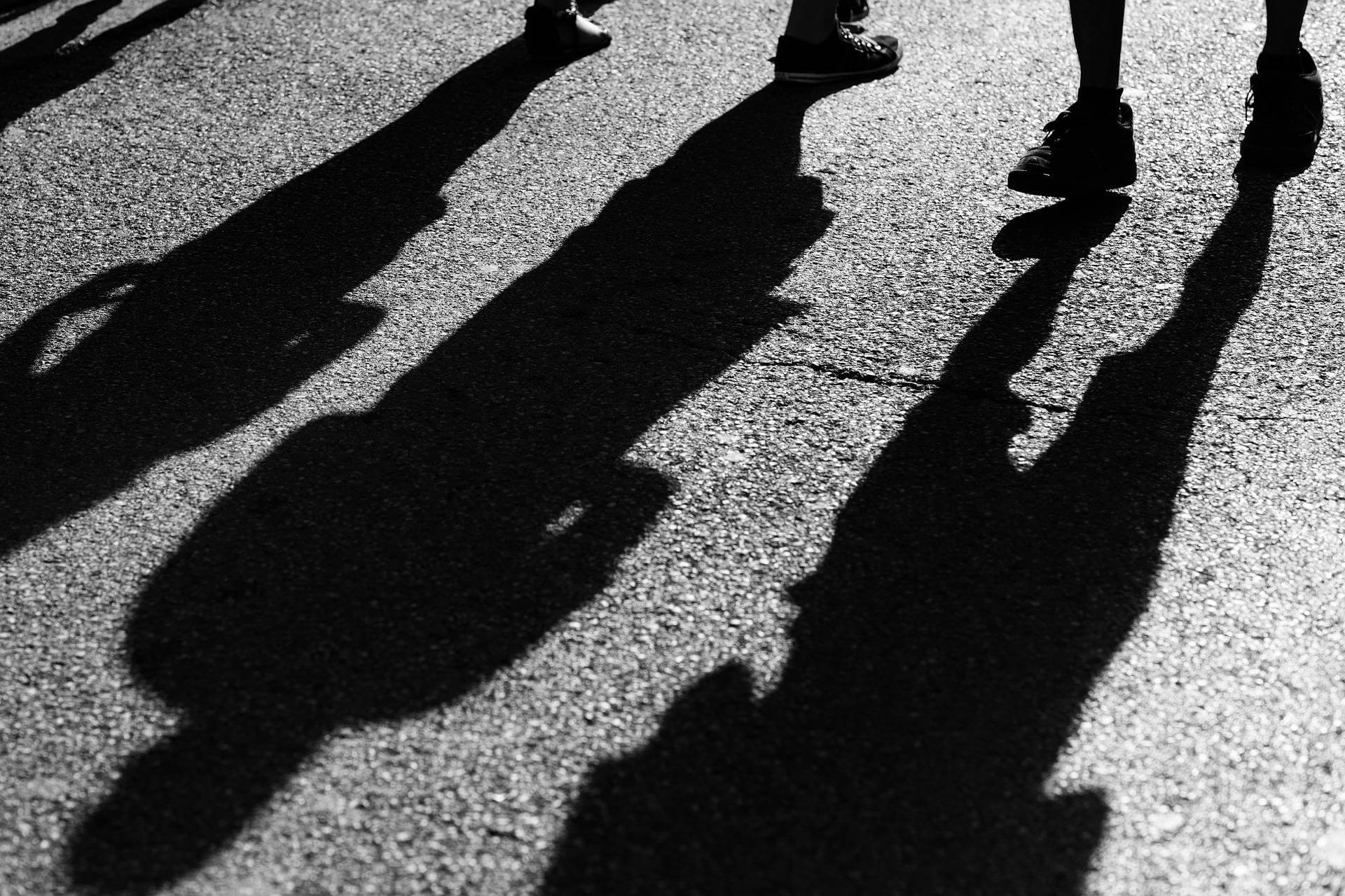 Some shadows on the ground symbolising Shadow Work.
