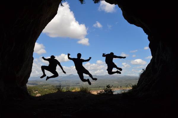 3 men jumping in the air seen as shadow symbolising shadow work.